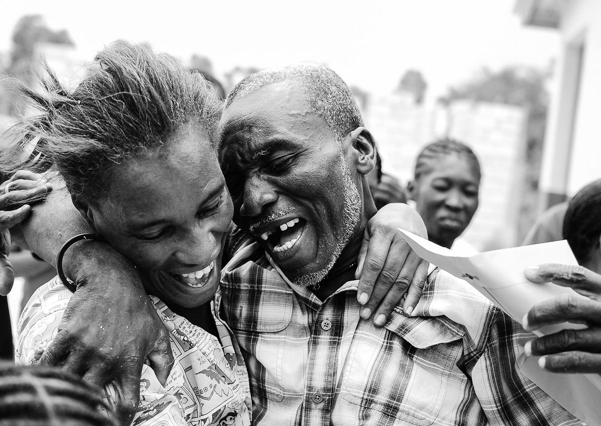 A Joyful Haitian Man Celebrates Winning A Community Contest Mike Trenh 