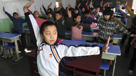 Pupils practice a set of martial arts 