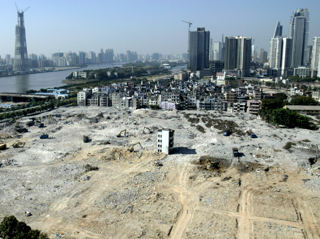 And that fall, in Guangzhou, the capital of China's Guangdong province, a single house stood defiant in the center of a construction site of a new apartment zone.