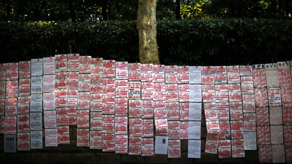 A wall of profiles of men and women looking for partners.