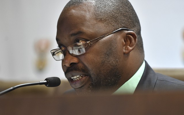 Michael Masutha, South Africa's minister of justice and correctional services, speaks to the press in Pretoria, South Africa, on Friday.