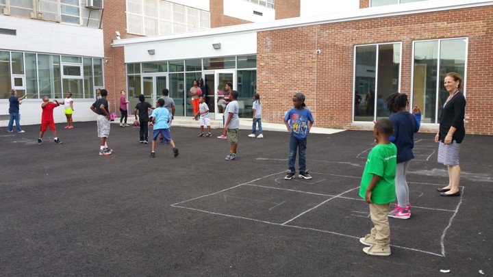 Are Urban Public Boarding Schools The Answer To Serving Students Who - monument academy founder and ceo emily bloomfield far right black sweater plays foursquare with students in the school yard courtesy of monument academy