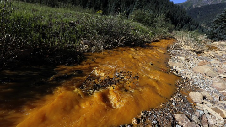 Water flows down Cement Creek just below the site of the blowout at the Gold King mine which triggered a major spill of toxic wastewater.