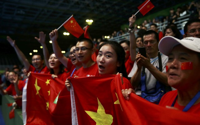 Fans cheer on Chinese athletes at the 2016 Olympics.