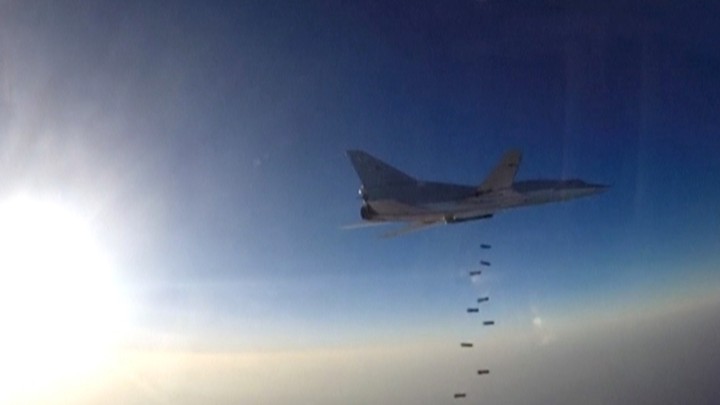 A Russian plane that took off from Iran drops bombs over ISIS targets in Syria.
