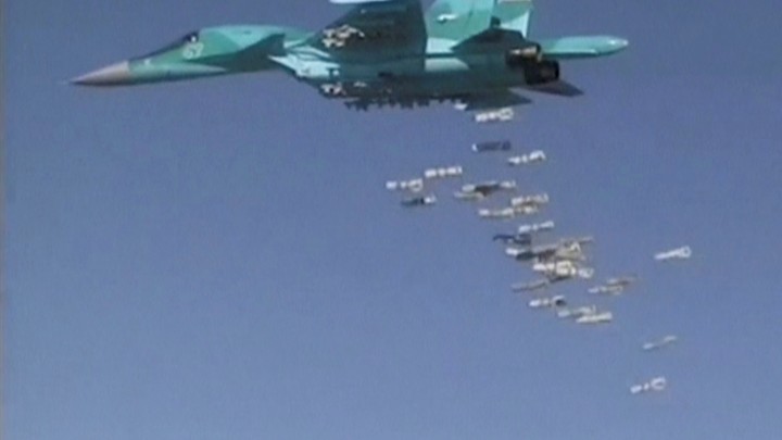 A Russian Sukhoi Su-34 fighter-bomber based at Iran's Hamadan air base, drops bombs in the Syrian province of Deir ez-Zor.