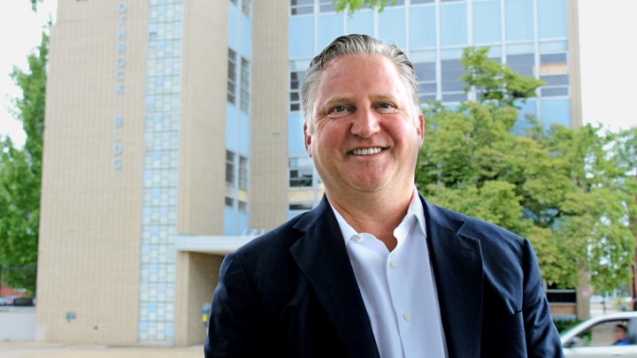 Joel Deuterman, founder and CEO of Velocity Network, outside downtown Erie's now-abandoned Rothrock Building, which he bought and will make his company's headquarters