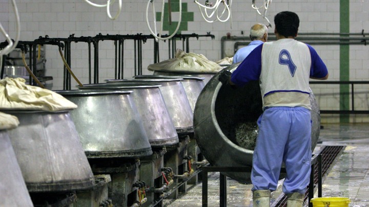 Iranian prisoners work in a kitchen in the Evin prison in Tehran, Iran, on June 13, 2006.