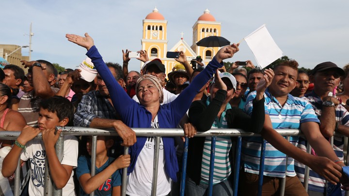 People enjoy a concert for peace in Carmen de Bolivar, Colombia, Sunday, Sept. 25, 2016. Colombia's government and the Revolutionary Armed Forces of Colombia, FARC, will sign a peace agreement to end over 50 years of conflict, in Cartagena, on Monday.