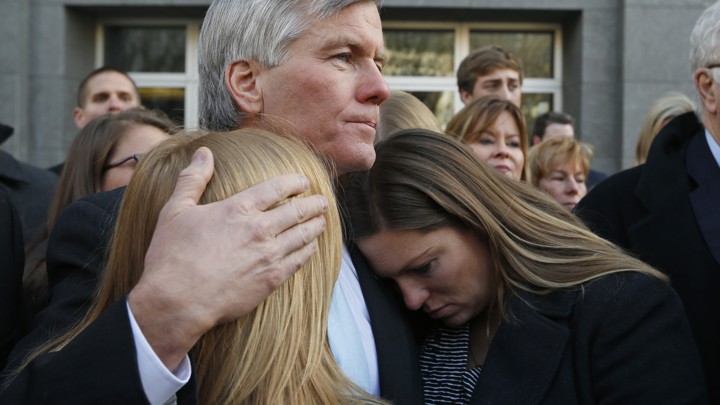 In this Tuesday, Jan. 6, 2015, file photo, former Virginia Gov. Bob McDonnell, center, hugs his daughters Cailin Young, left, and Jeanine McDonnell Zubowsky, right, after speaking outside federal court in Richmond, Va. McDonnell was sentenced to two years prison and two years probation in his corruption case.