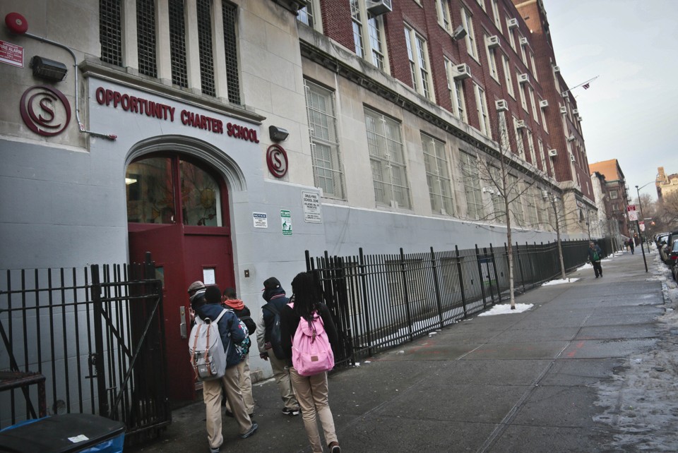A group of students enters Opportunity Charter School in New York.