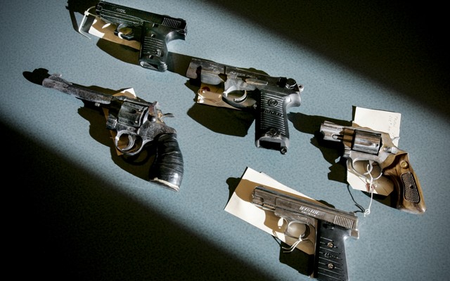 Recently seized handguns are displayed at the Boston police headquarters in Massachusetts on December 7, 2005.