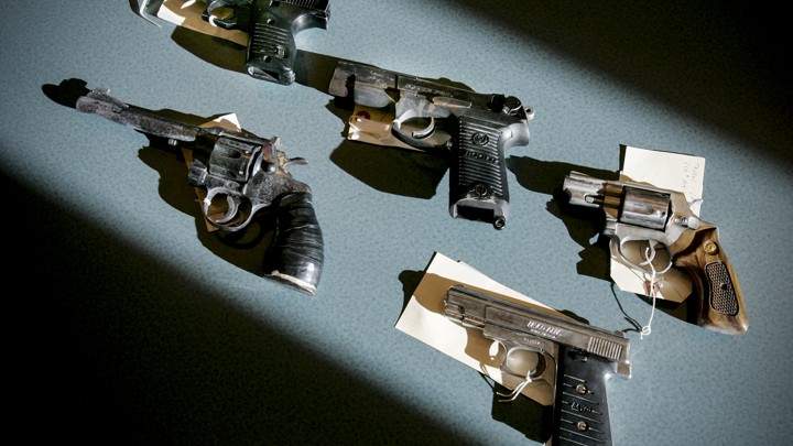 Recently seized handguns are displayed at the Boston police headquarters in Massachusetts on December 7, 2005.
