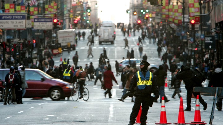 An NYPD officer monitoring traffic on Fifth Avenue