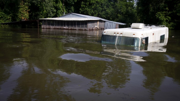 A house and RV submerged in water in Butte Larose, Louisiana in 2011.