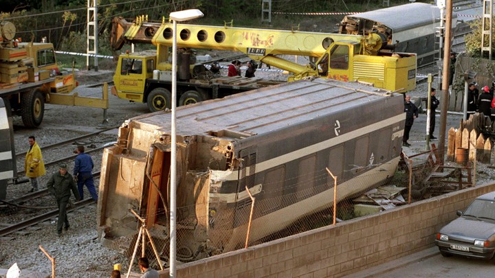Workers clean up the wreckage of a train crash in Spain on September 9.