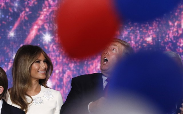 Melania Trump and her husband Donald celebrate with family as balloons fall at the conclusion of the Republican National Convention in Cleveland in July.