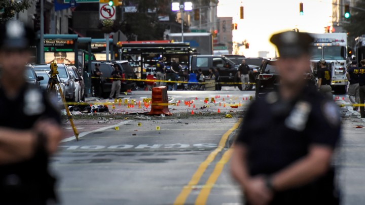 New York police officers stand near the site of an explosion in Manhattan's Chelsea neighborhood.