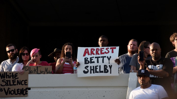 Protesters call for the arrest of Betty Shelby, the officer who fatally shot Terence Crutcher, outside police headquarters in Tulsa, Oklahoma.