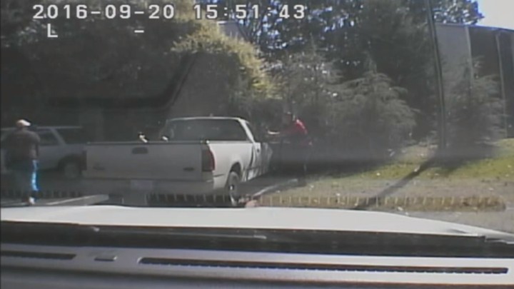 Keith Scott looks over to police with hands by his sides a second before he was shot four times by Charlotte police.