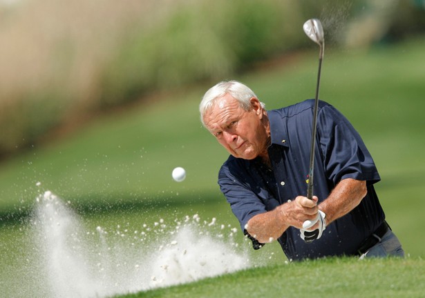 Arnold Palmer hits from a sand trap during the annual Masters Par 3 golf tournament in 2008.