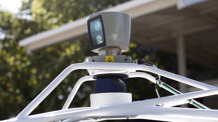 A sensor spins atop a Google self-driving vehicle