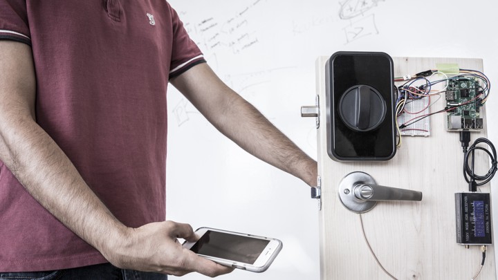 An engineer uses a smartphone's fingerprint reader to send a passcode through his body