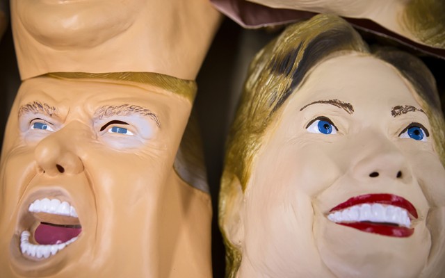 Rubber masks in the likeness of Donald Trump and Hillary Clinton are stacked at a factory in Saitama, Japan. 