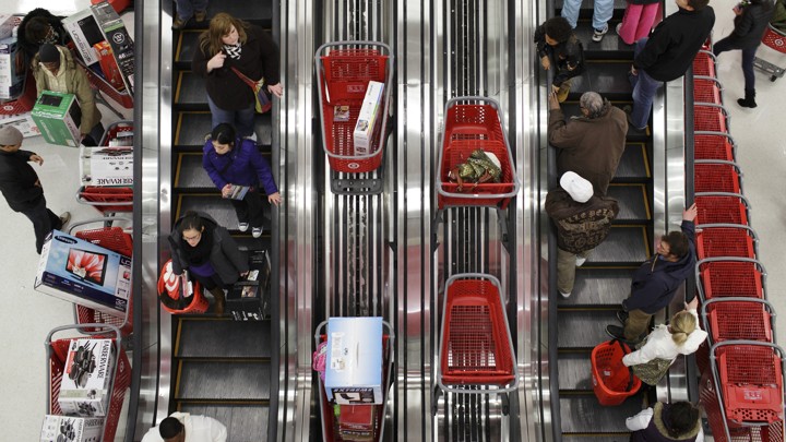Shoppers ride an escalator in a Target store in Chicago