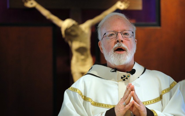 Cardinal Sean O'Malley of Boston celebrates Mass before a crucifix. He is leading the opposition against Question 4, a Massachusetts ballot initiative that would legalize recreational use of weed. 