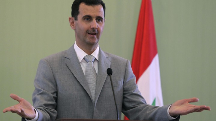 Syria's President Bashar al-Assad gestures as he speaks during a news conference with Turkey's Prime Minister Tayyip Erdogan, after their meeting in Damascus October 11, 2010.