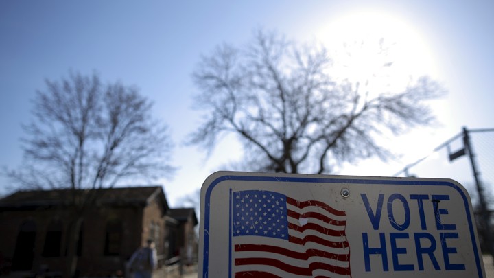 A voter arrives to cast their ballot in the Wisconsin presidential primary election at a voting station in Milwaukee, Wisconsin.