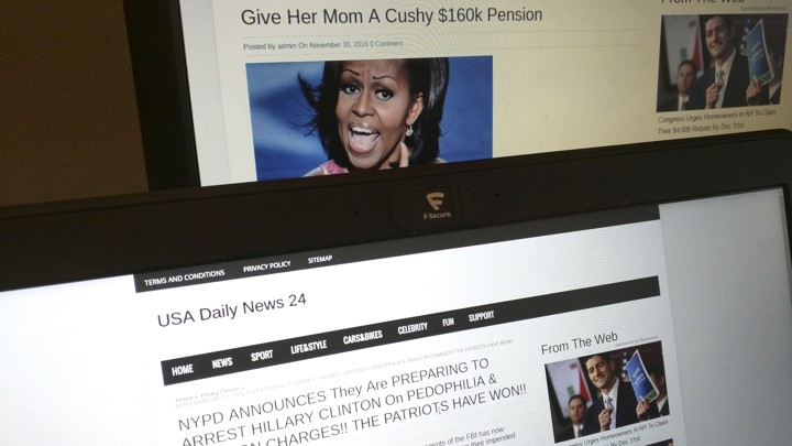 Fake news articles appear on laptop screens