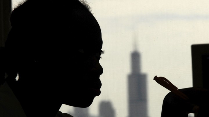A student listens during class at Chicago's North Lawndale College Preparatory High School, where 8 percent of students were estimated to be homeless in 2008.