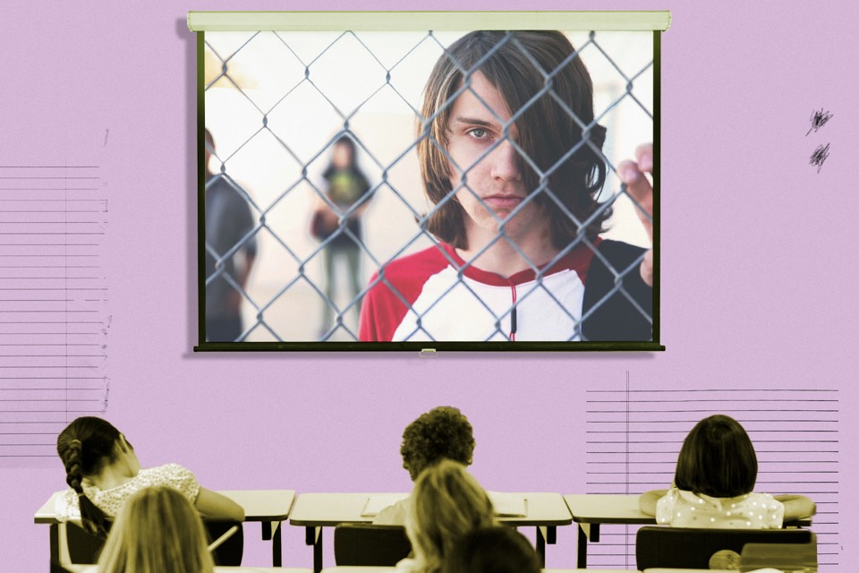 A frame from the documentary "Bad Kids" fills the screen of a projector in a classroom.