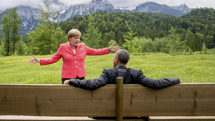 Chancellor Angela Merkel speaks with President Barack Obama outside the Elmau castle in Kruen near Garmisch-Partenkirchen, Germany.