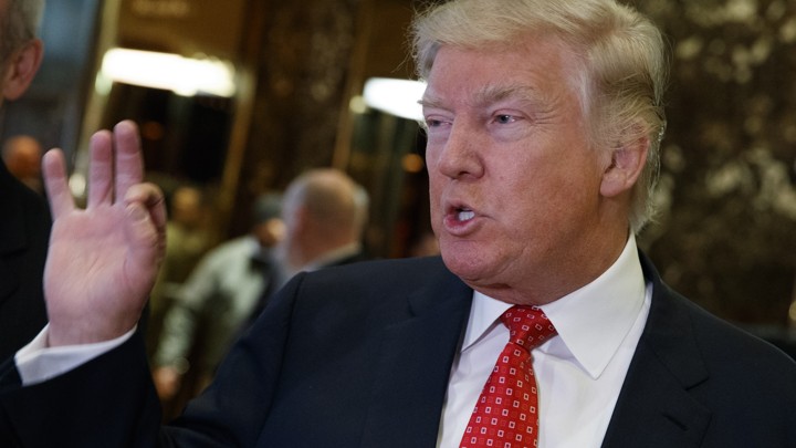 President-elect Donald Trump talks with reporters in Trump Tower in New York.