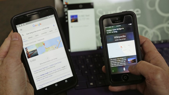 A reporter uses Google, Cortana, and Siri digital assistants to find the length of the Golden Gate Bridge.
