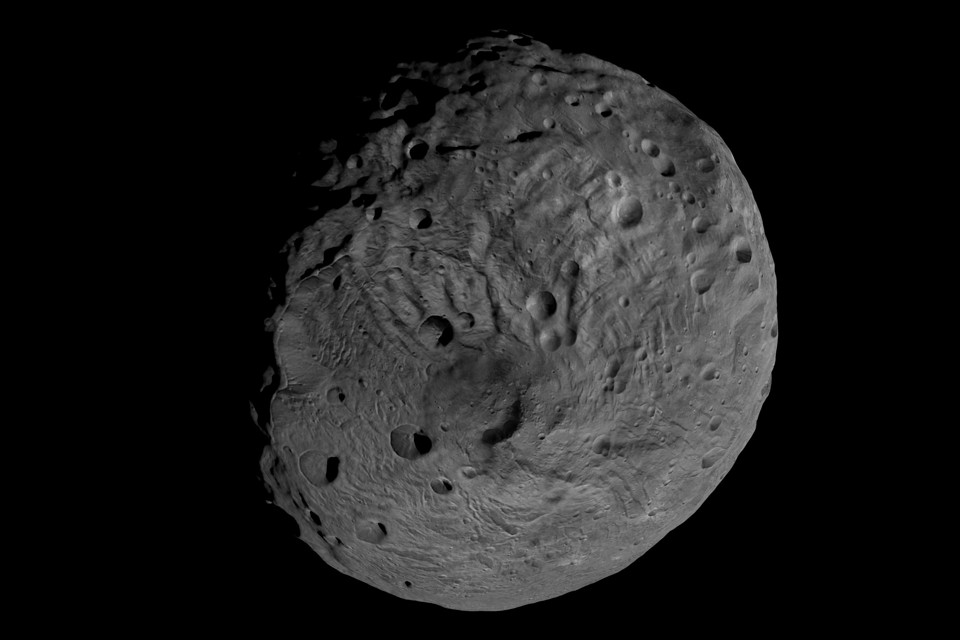 Vesta, a rocky asteroid orbiting between between Mars and Jupiter