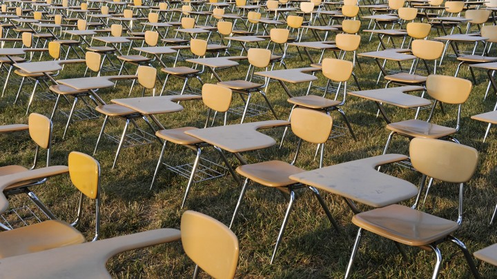 Empty desks fill the frame.