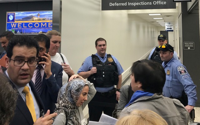 Lawyers gather to discuss how to gain access to detainees held under a travel ban imposed by President Donald Trump's executive order.