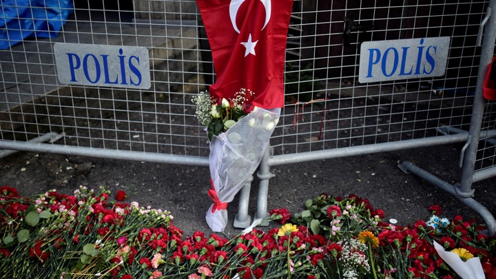 Flowers and a Turkish flag outside the Reina nightclub in Istanbul