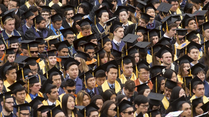 A sea of graduates in caps and gowns