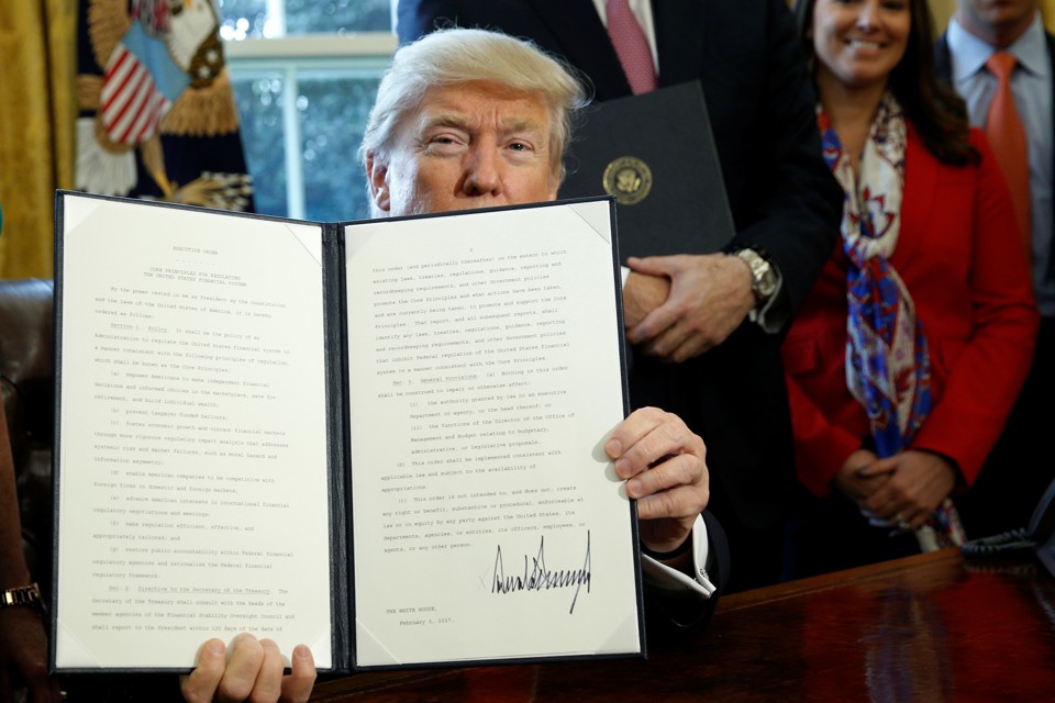 President Trump holds an executive order related to financial regulation.