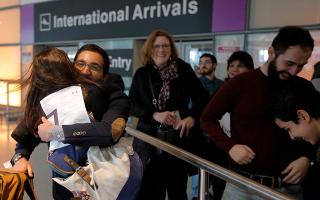 Behnam Partopour, a student from Iran, is greeted by his sister Bahar at Logan Airport after he cleared U.S. customs and immigration on an F1 student visa in Boston.