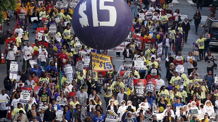 Demonstrators at a Fight for $15 rally to raise the minimum wage