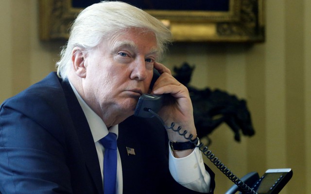 Trump speaks by phone with Merkel in the Oval Office at the White House in Washington