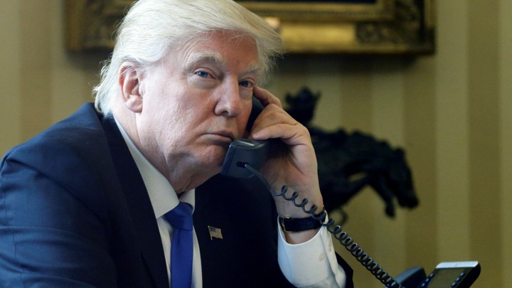 Trump speaks by phone with Merkel in the Oval Office at the White House in Washington