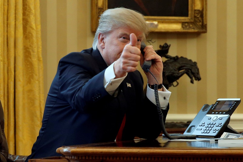 President Donald Trump gives a thumbs-up as he waits to speak by phone with Saudi Arabia's King Salman.