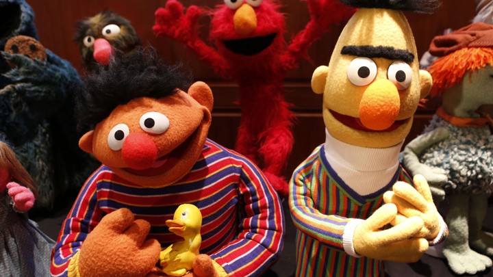 Characters from the Muppets are pictured smiling
